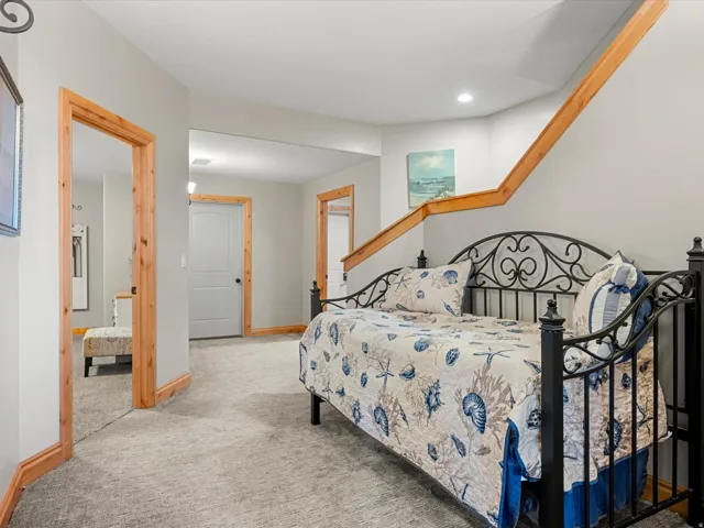 Finished lower level featuring light gray walls and plush gray carpeting