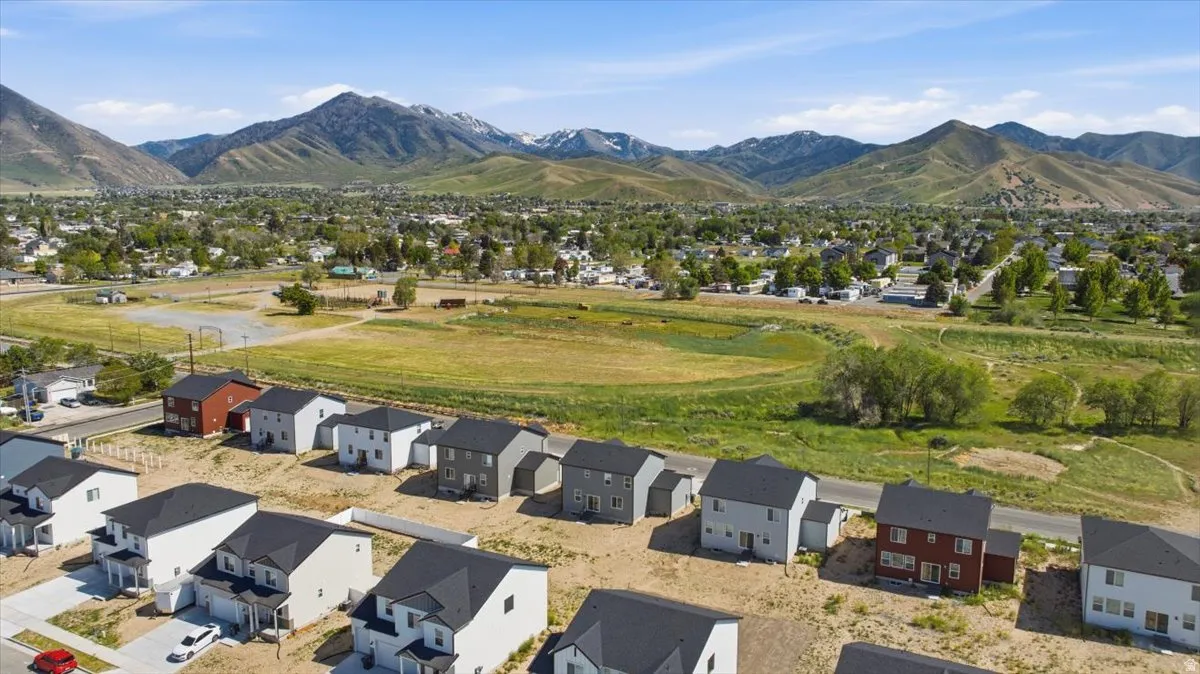 New construction homes featuring varied exterior finishes and attached garages