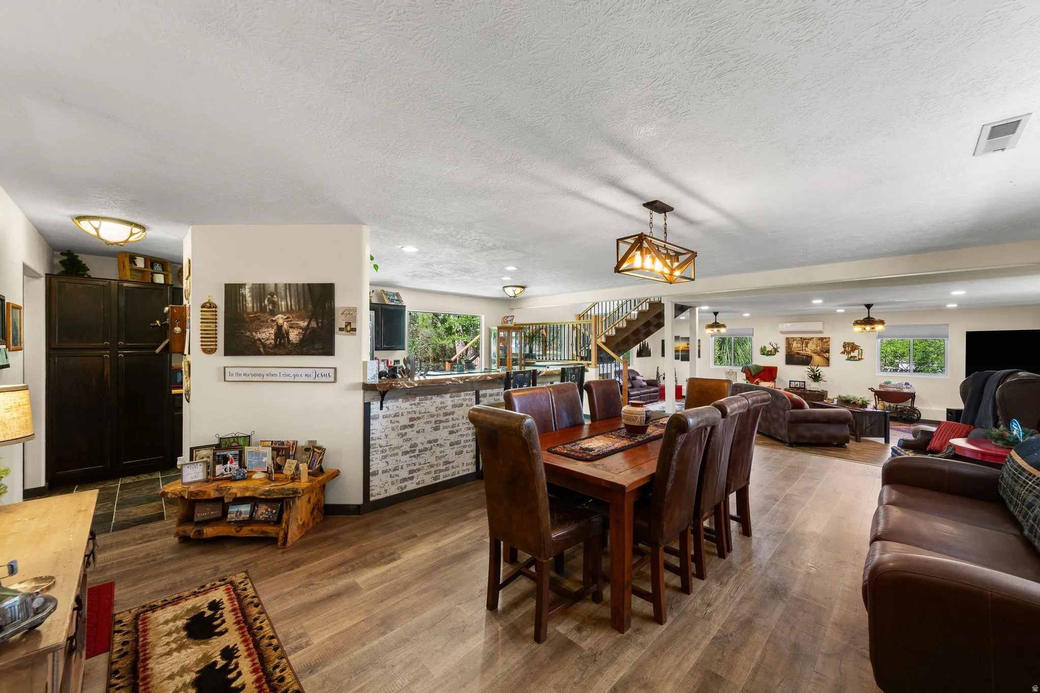 Open-concept living space with wood-finish flooring