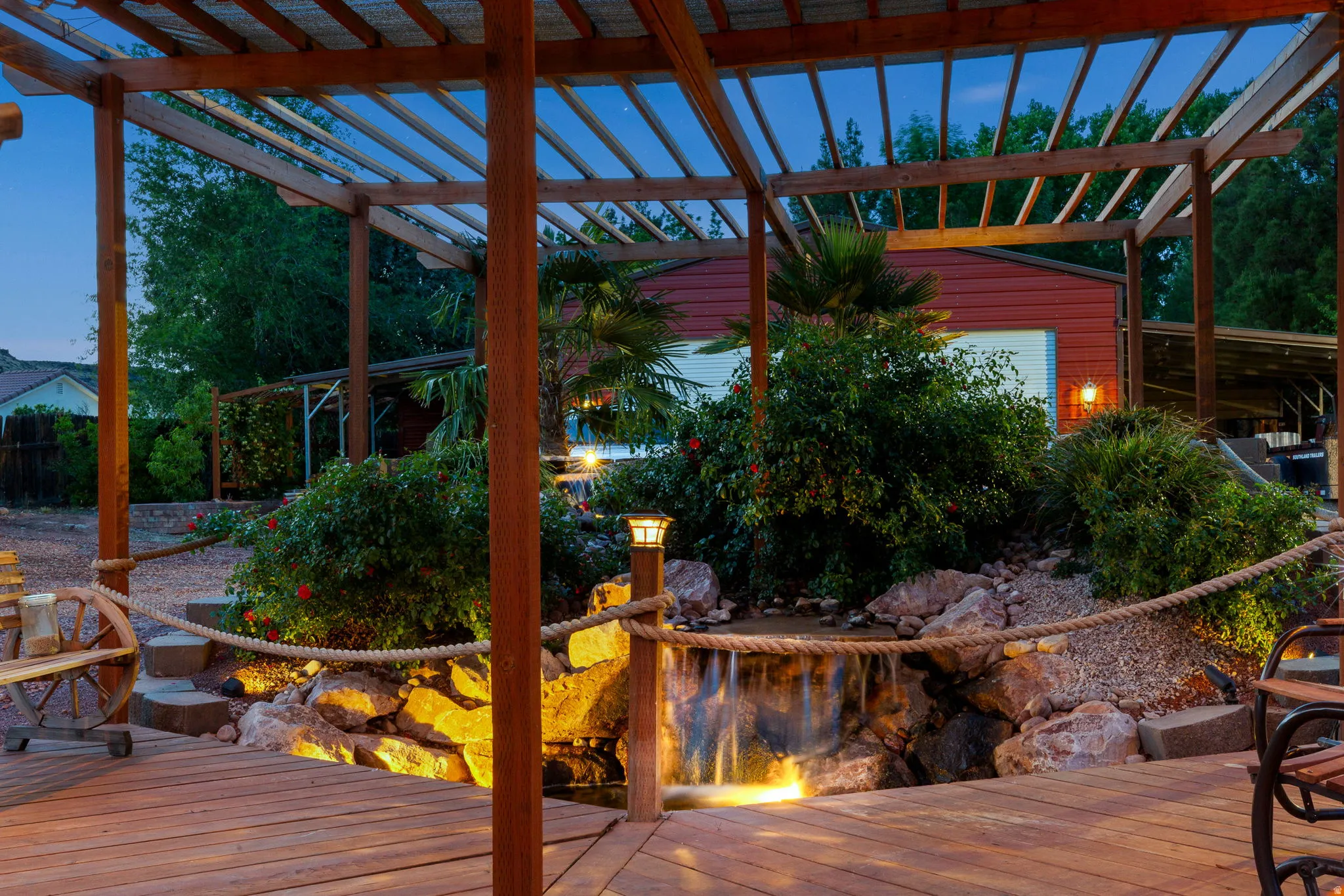 Expansive wooden deck with a slatted pergola overhead