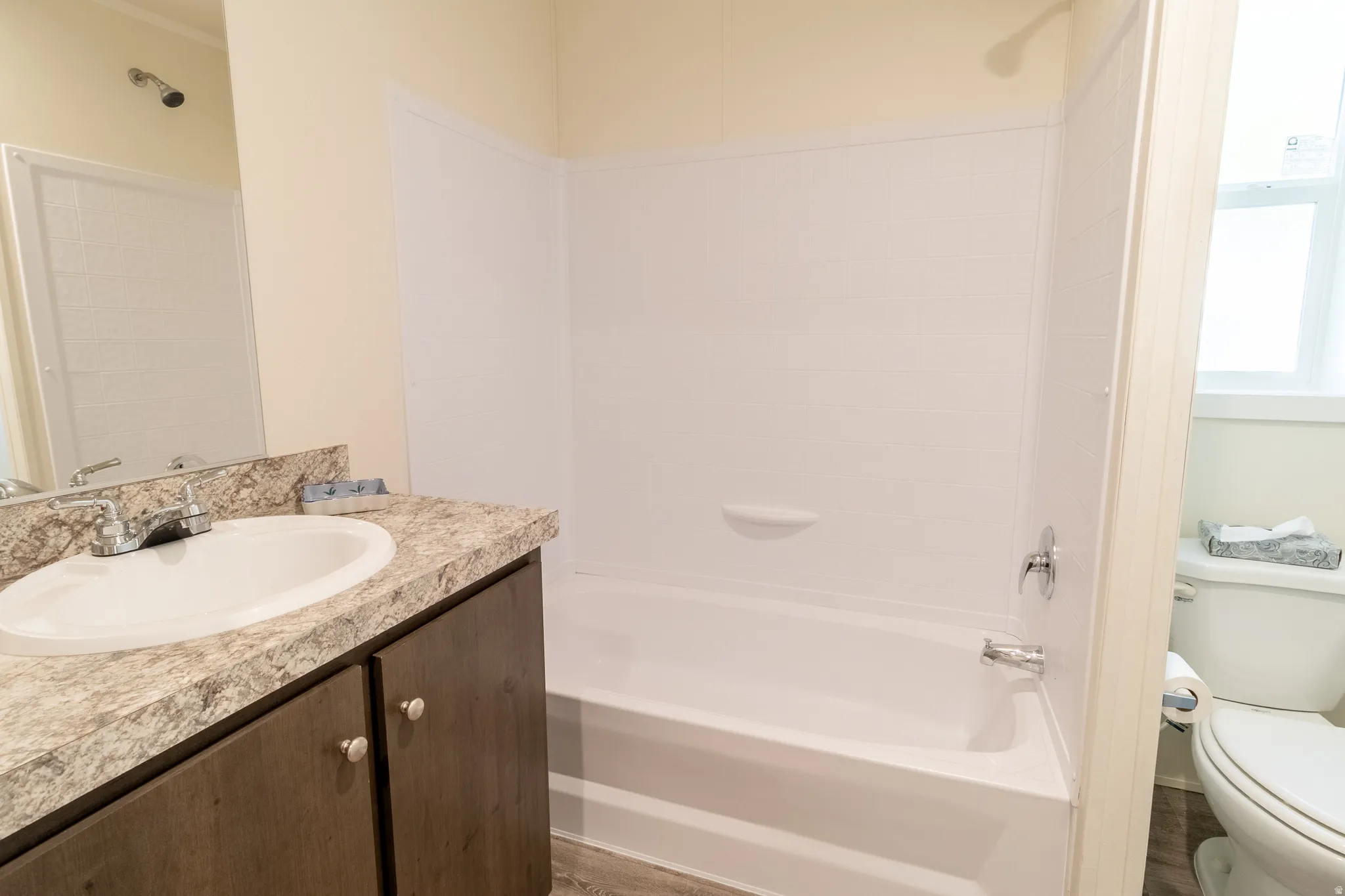 Full bathroom featuring vanity and bathing tub / shower combination