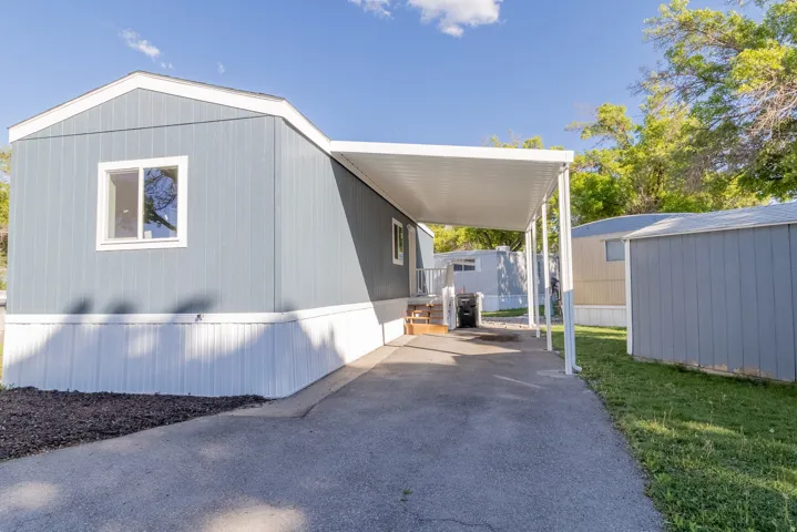 Property exterior with blue siding and white trim