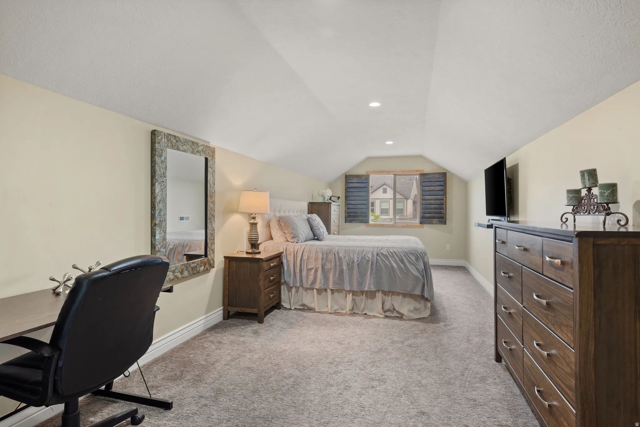 This is being used as a large bedroom but could also be considered a loft bonus space.