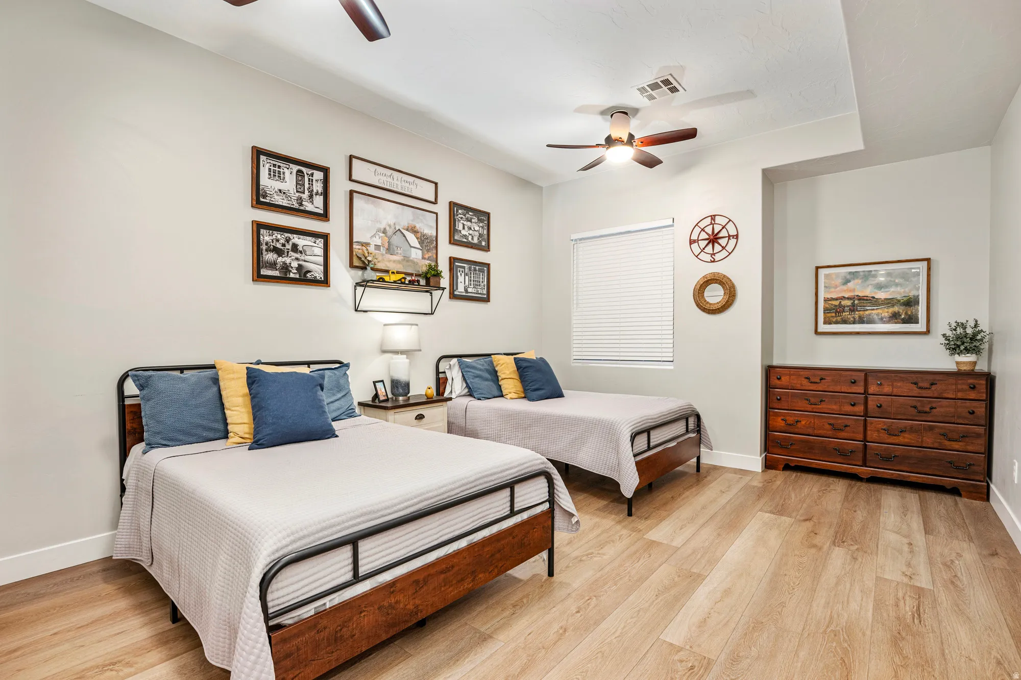 Light-toned wood-finish flooring complements neutral wall tones and white baseboards