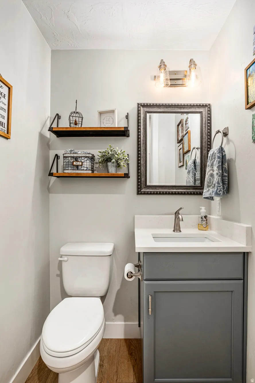 Vanity with a light-colored countertop, undermount sink, and brushed nickel faucet