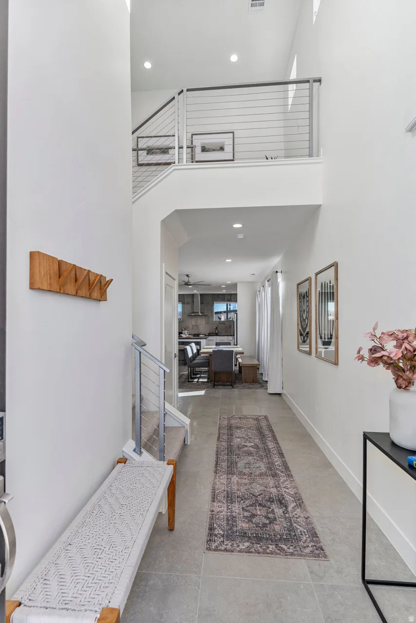 Two-story entry foyer featuring high ceilings and recessed lighting