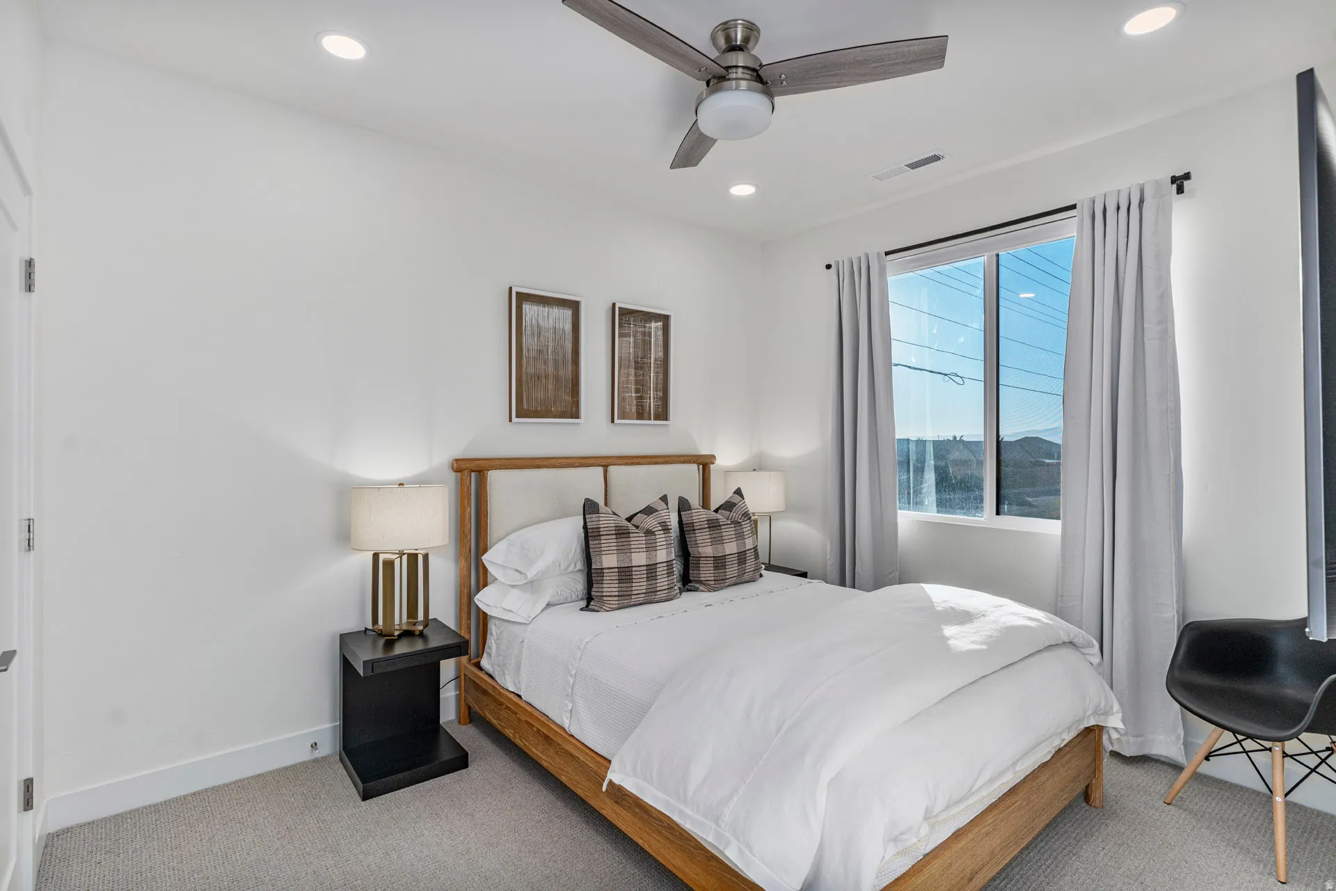 Third bedroom featuring a large window with neutral drapery, recessed lighting, and a ceiling fan