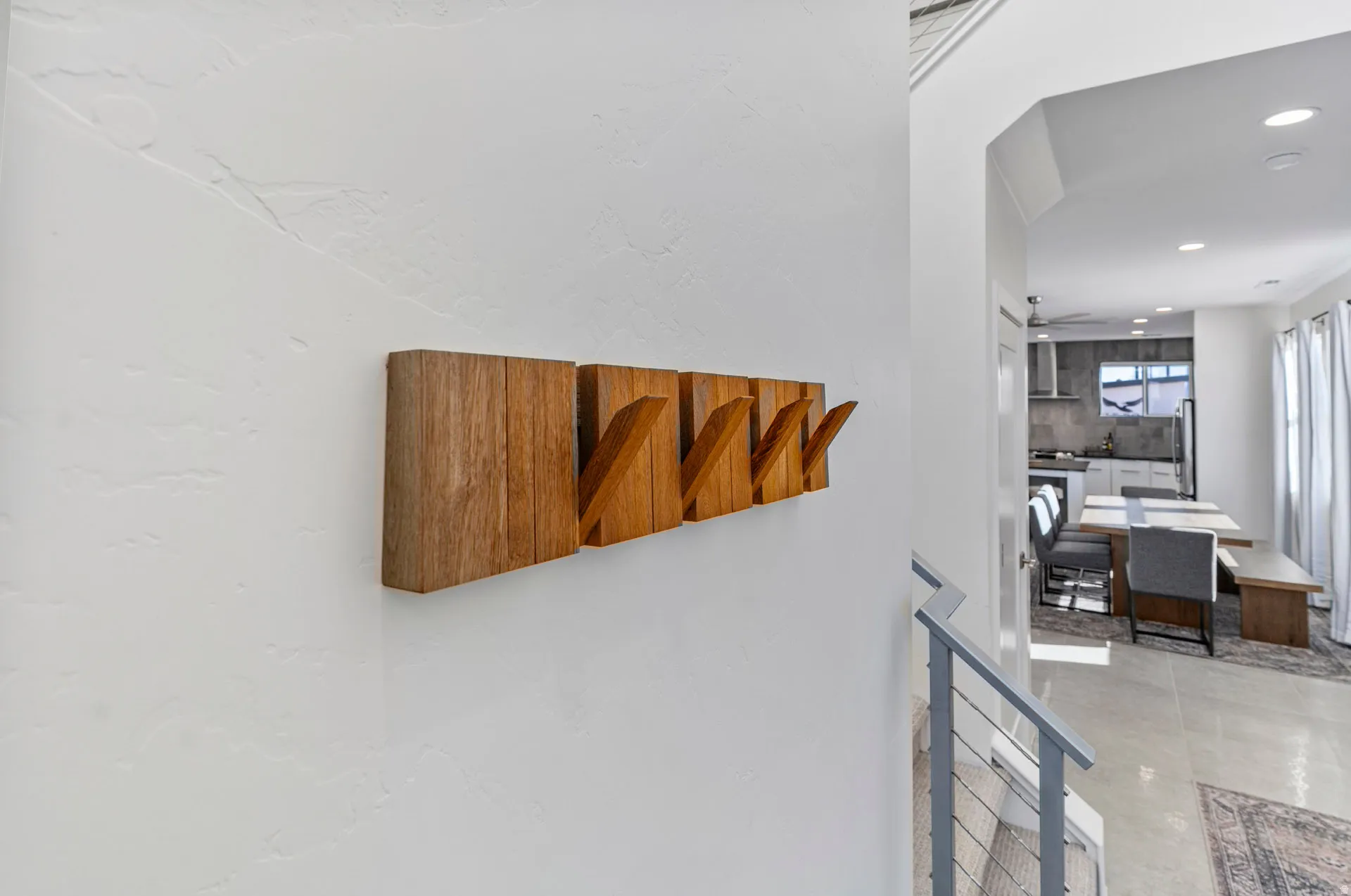 Textured wall with wood-finish coat rack