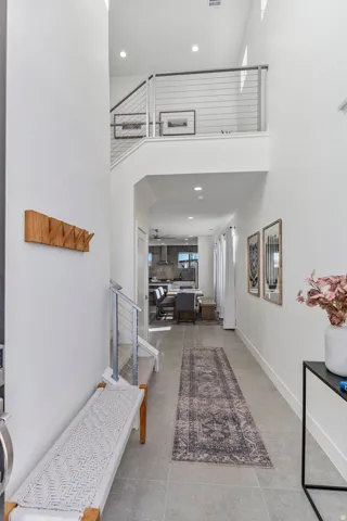 Two-story entry foyer featuring high ceilings and recessed lighting