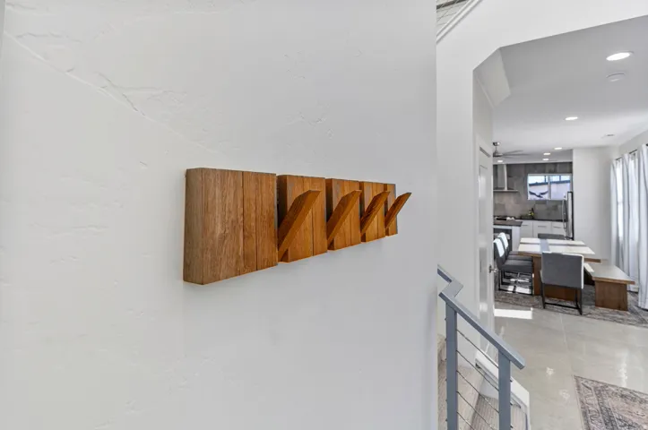 Textured wall with wood-finish coat rack
