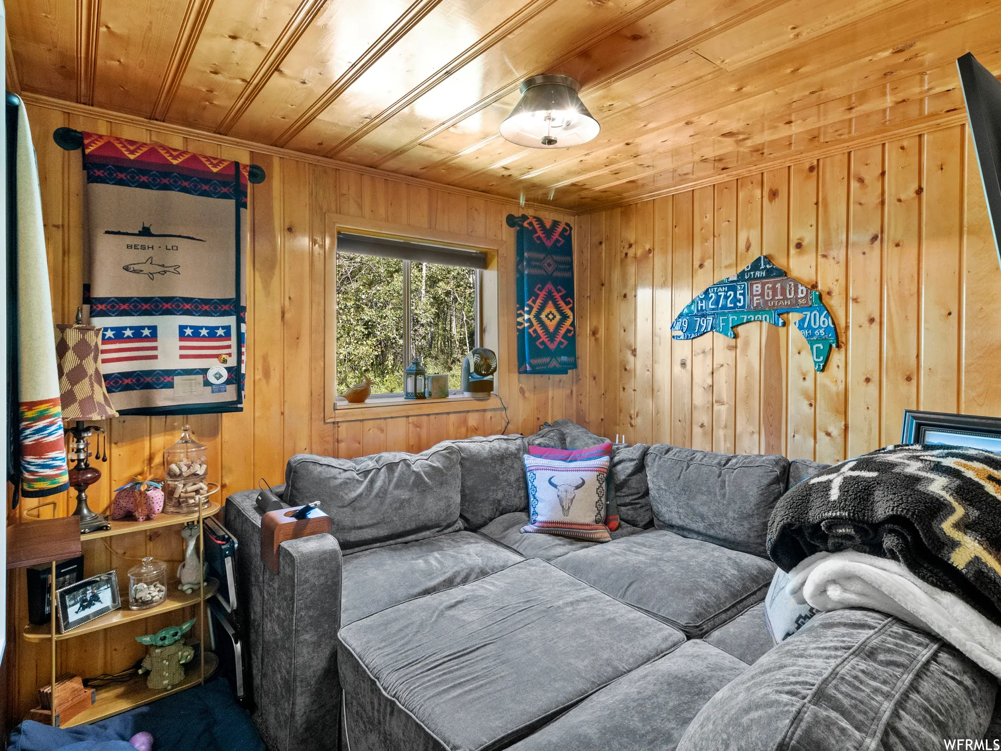 Pine paneling throughout, featuring a natural wood finish