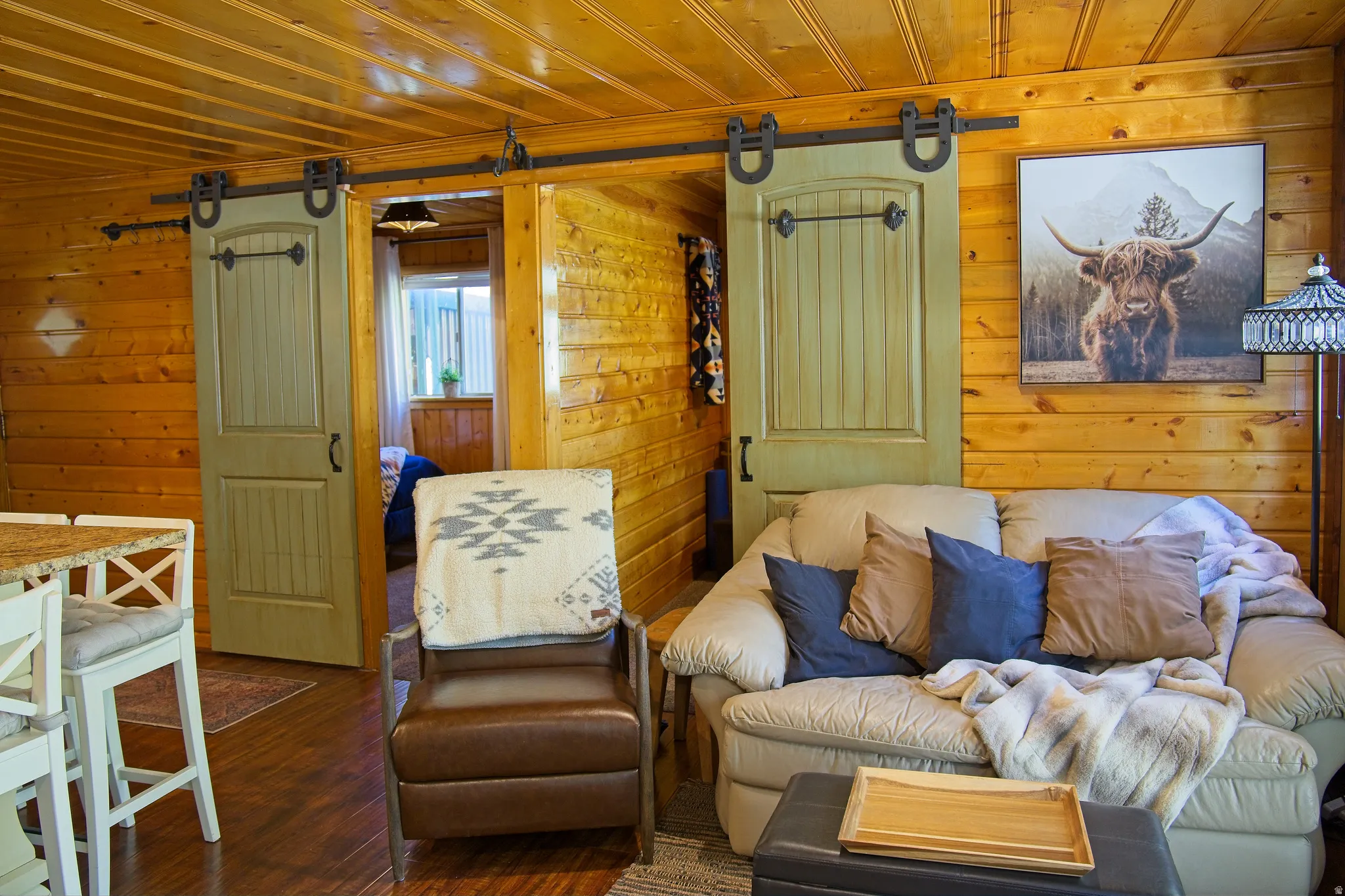 Interior space featuring full wood-paneled walls and a matching wood-paneled ceiling