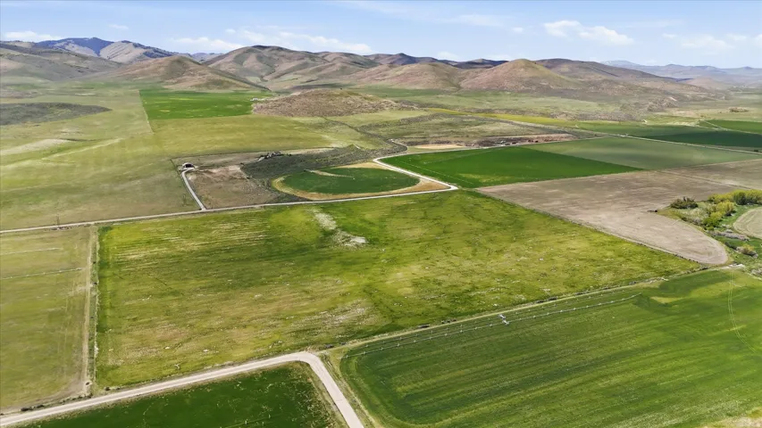Expansive agricultural acreage featuring multiple cultivated fields and visible irrigation systems
