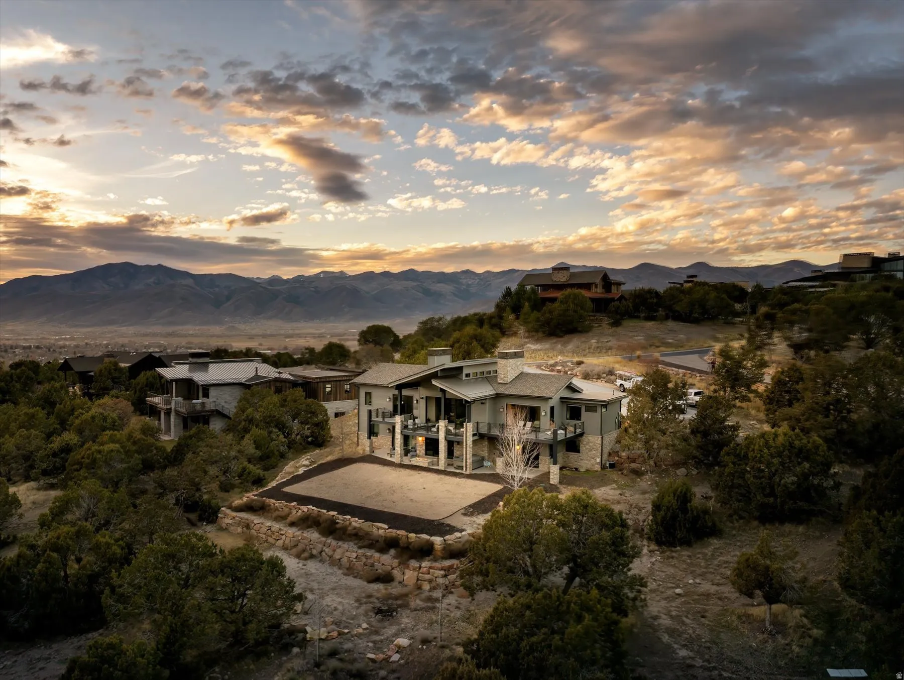 Contemporary mountain residence with multi-level design and stone accents