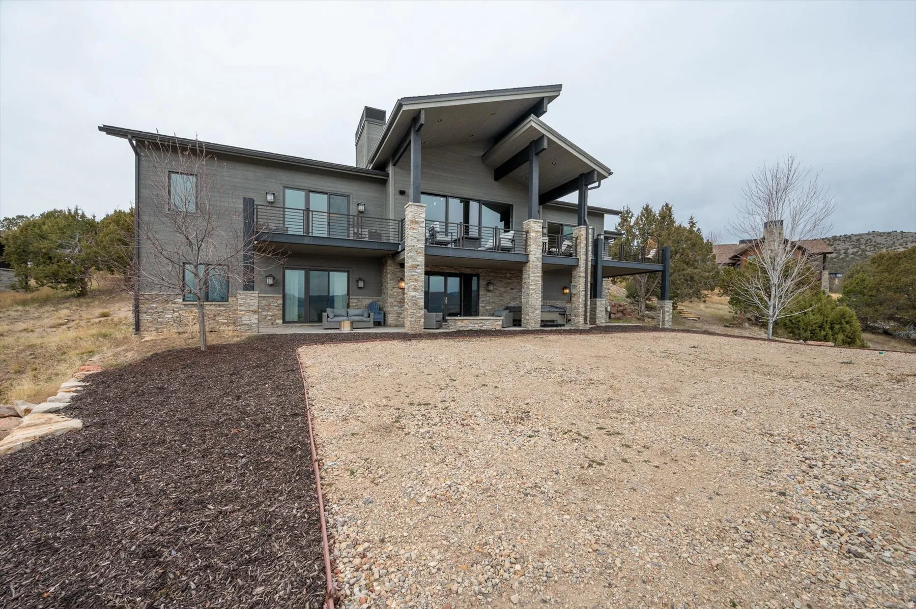 Modern exterior featuring stacked stone accents.