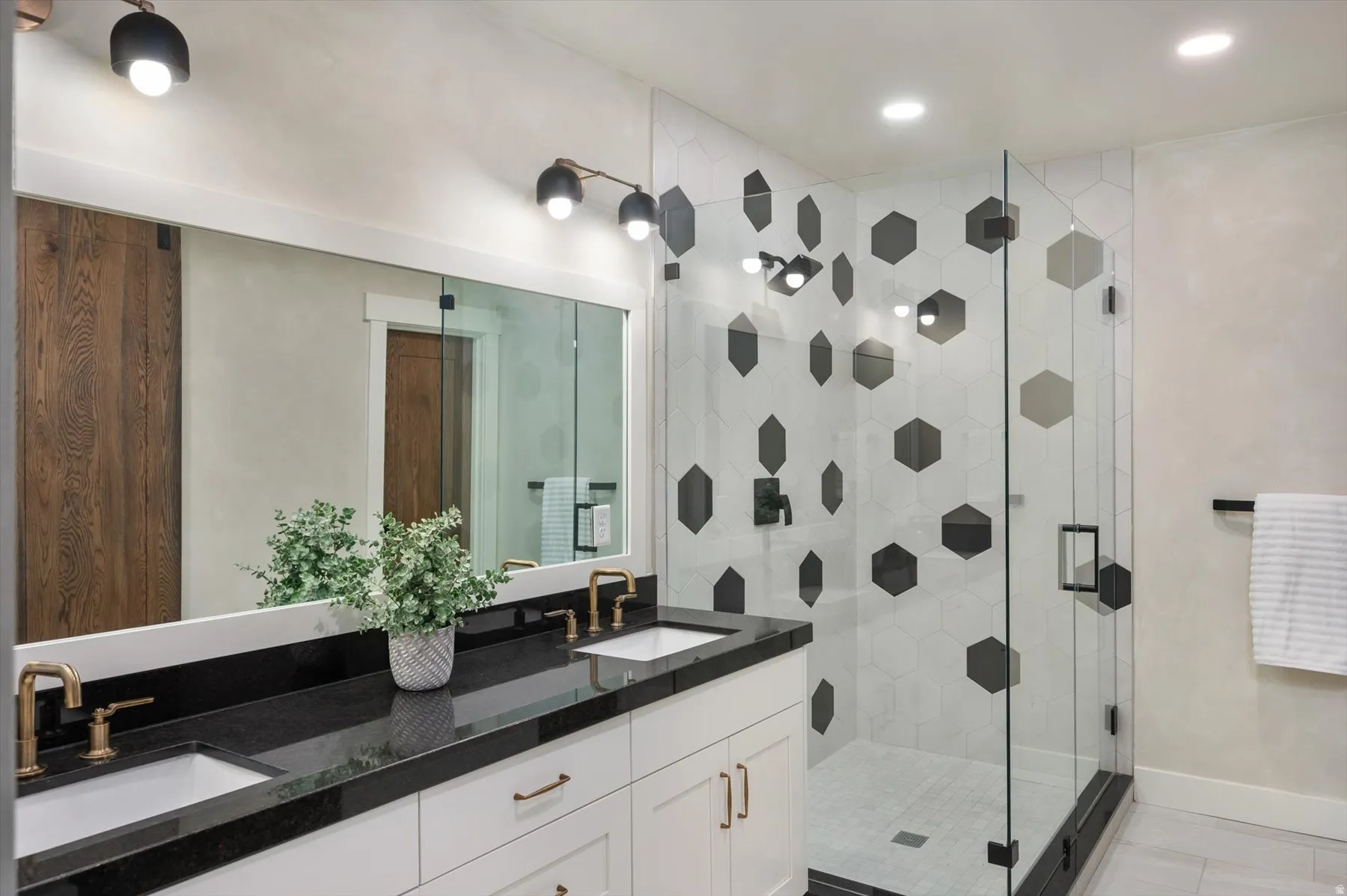 Bathroom featuring a dual vanity with
