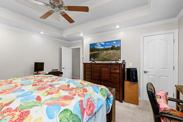 Tray ceiling with recessed lighting and crown molding