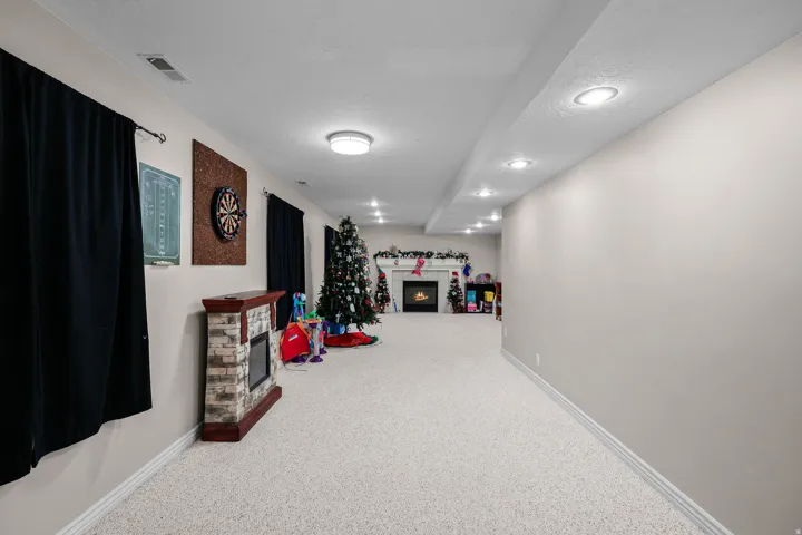 Expansive lower level featuring neutral carpeting throughout