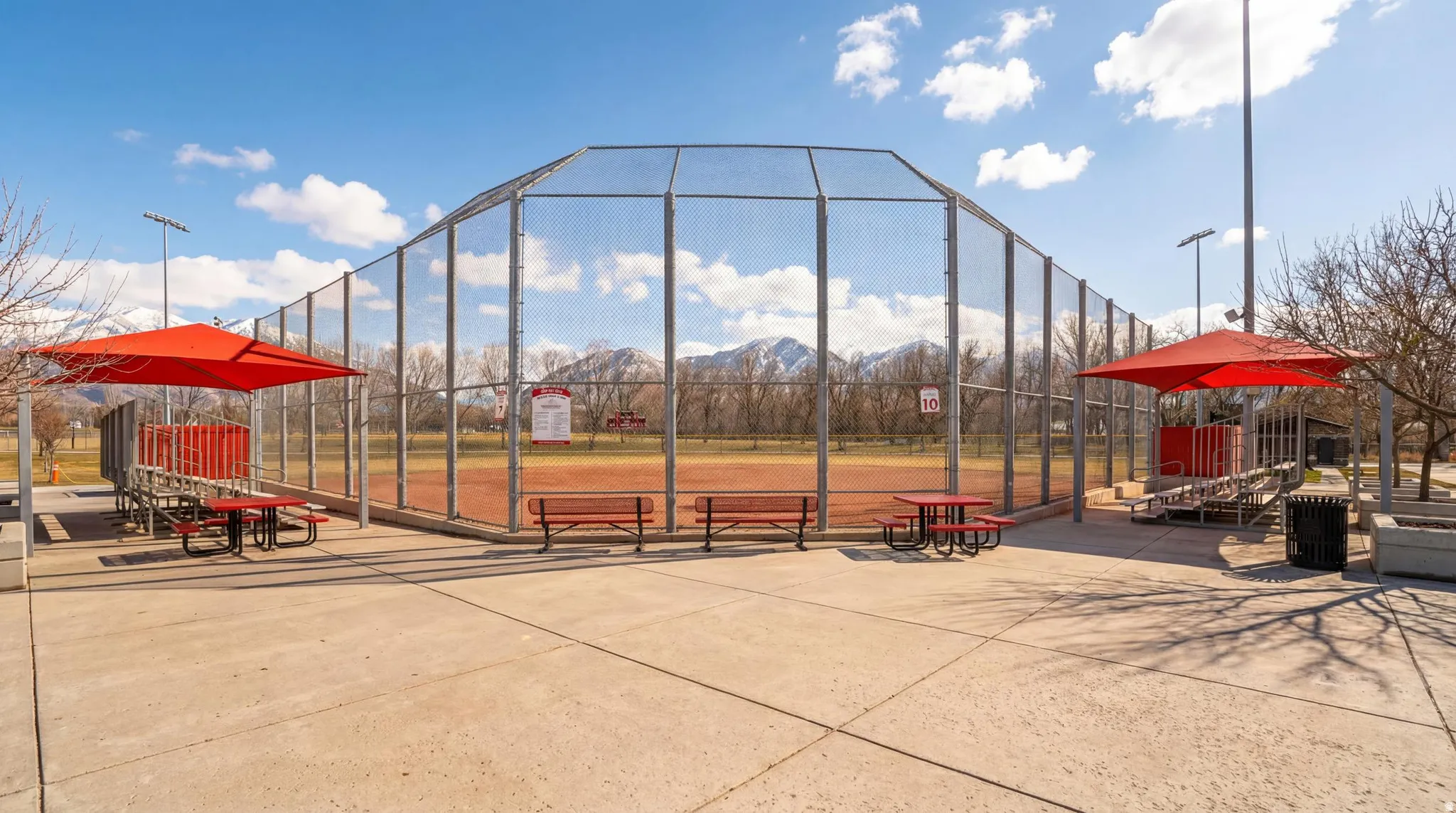 Baseball field with a chain-link backstop and outfield fencing