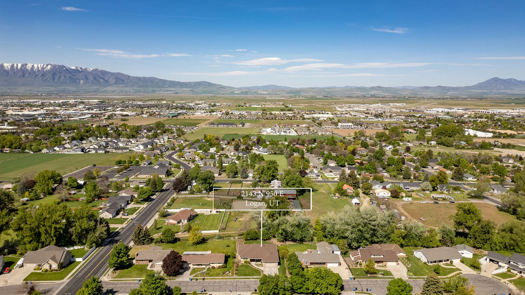 Spacious lot featuring mature trees and established landscaping, surrounded by a residential neighborhood