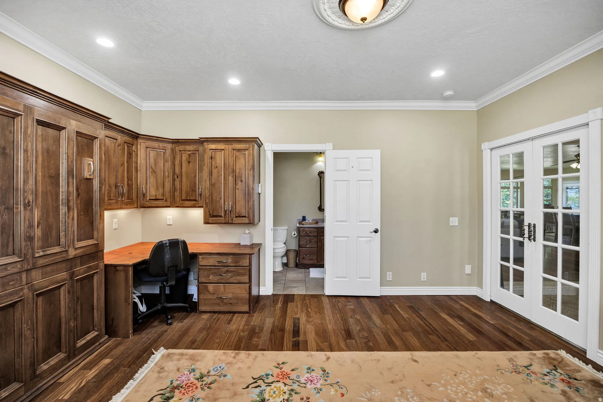 Custom built-in wood cabinetry with integrated desk space