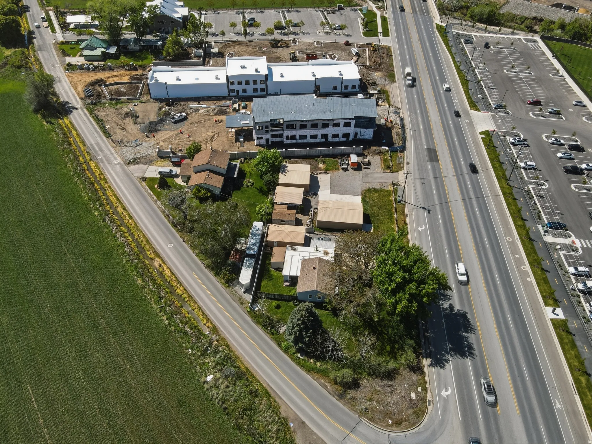 Aerial perspective showcasing a parcel with multiple buildings