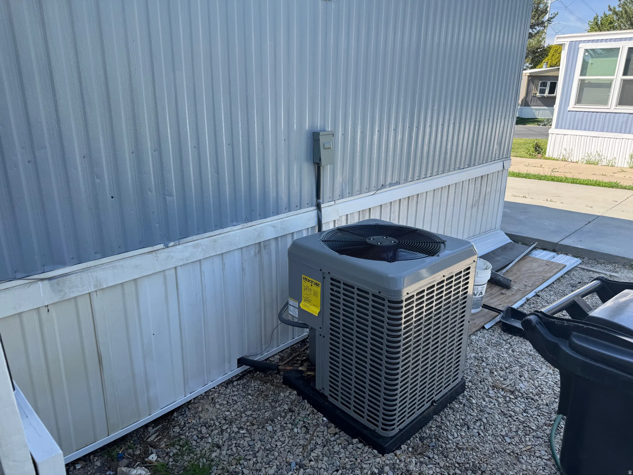 Central air conditioning unit on a gravel base