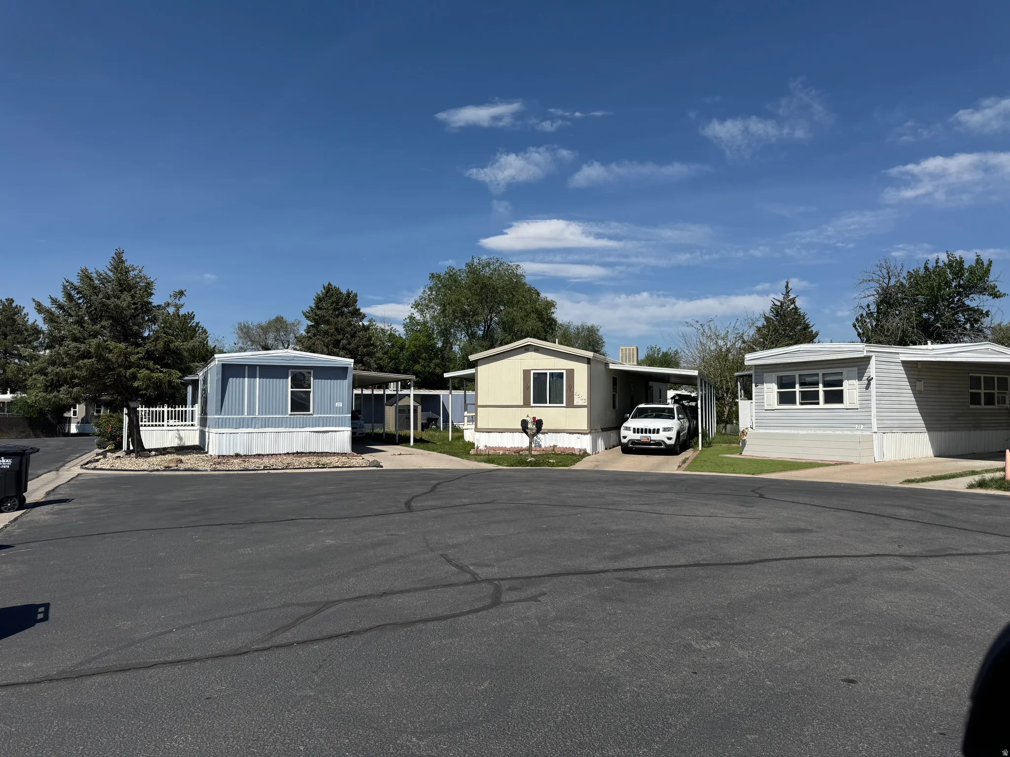 Variety of manufactured homes featuring diverse siding materials and exterior colors