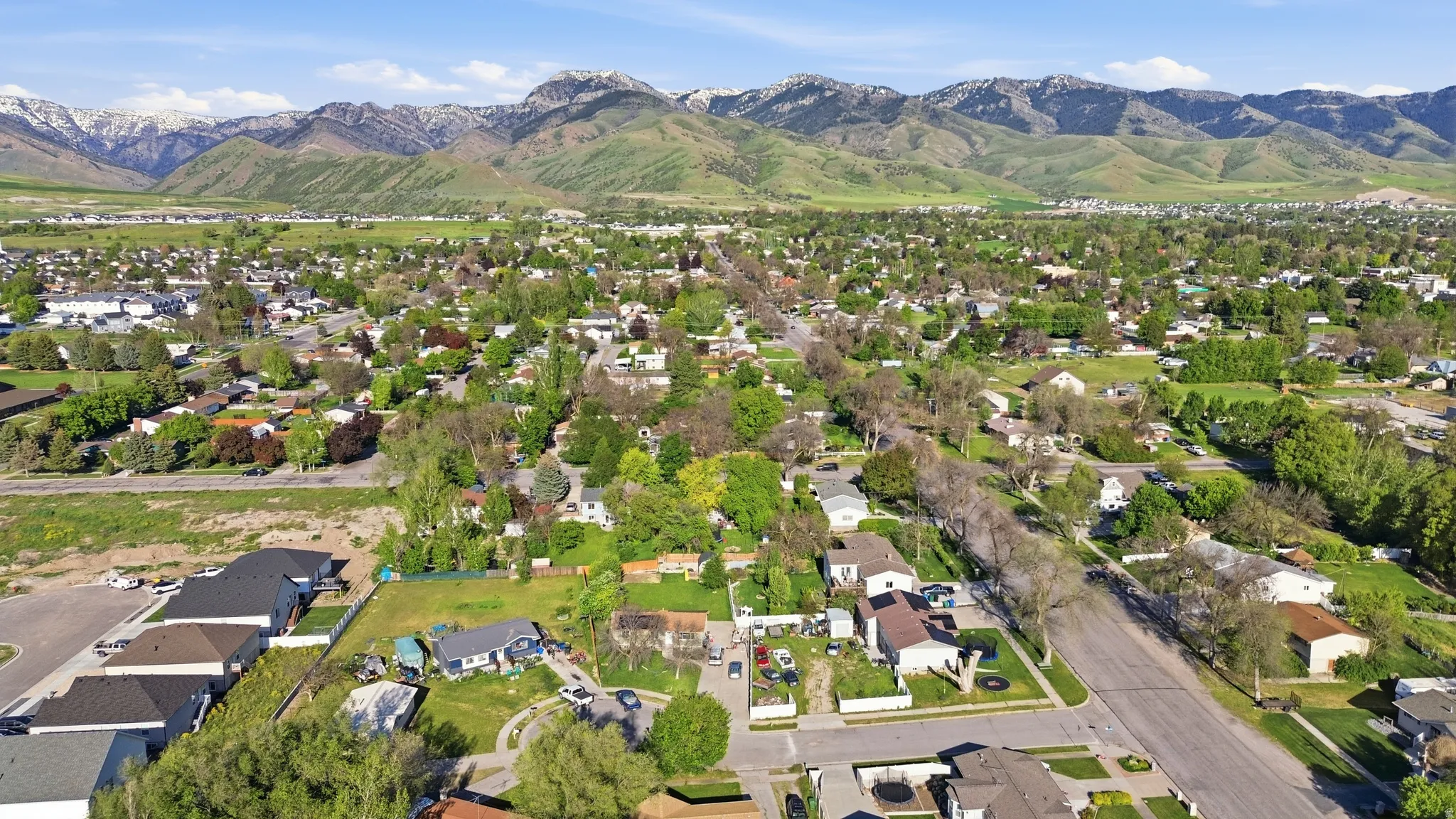 Expansive aerial perspective showcasing a residential area with varied housing styles