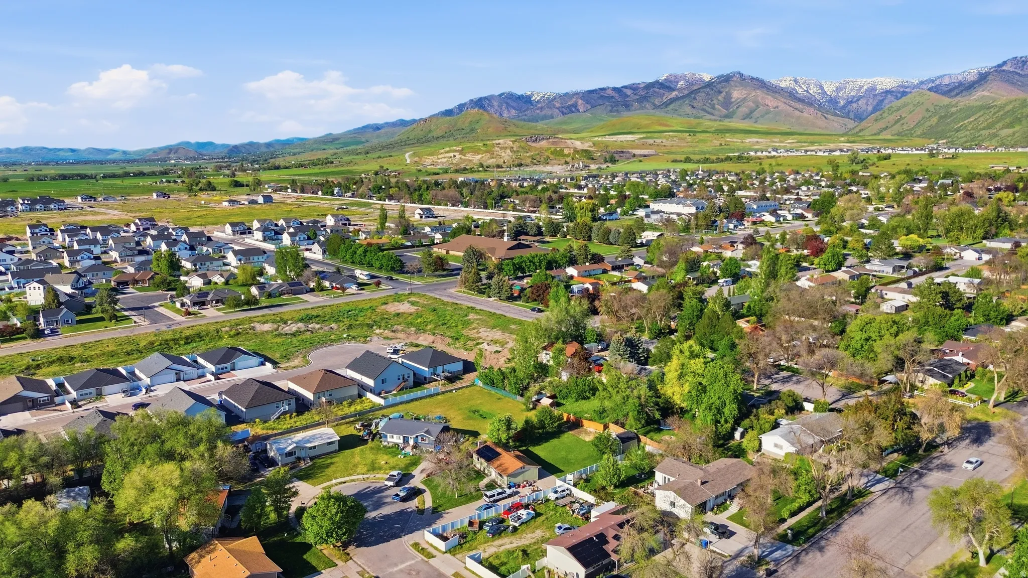 Expansive aerial perspective showcasing a residential community with varied architectural styles