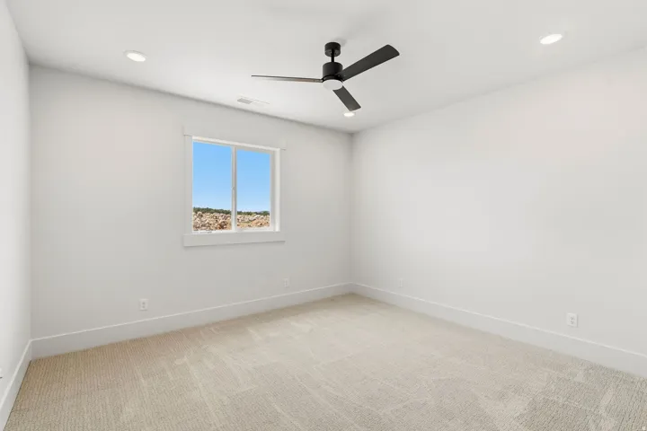 Neutral tone carpeting paired with crisp white walls