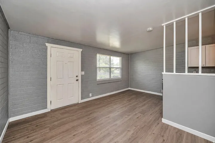 Foyer featuring baseboards and dark wood finished floors
