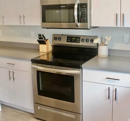 Stainless steel range with a coordinating over-the-range microwave