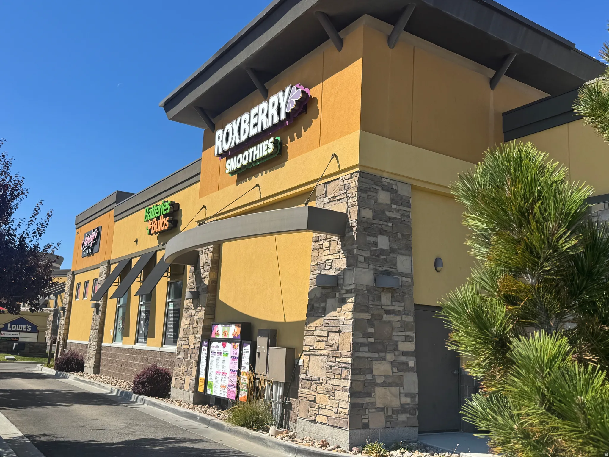Commercial building with stucco exterior and stone veneer accents