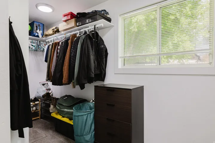 Built-in closet system featuring shelving and hanging rods