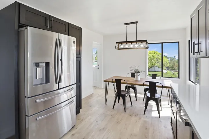 Bright dining area with light wood-finish flooring