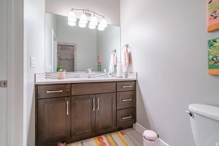 Bathroom featuring vanity and toilet
