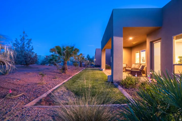 View of grassy yard featuring a patio area and an outdoor lounge area