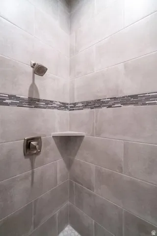 Bathroom featuring tiled shower