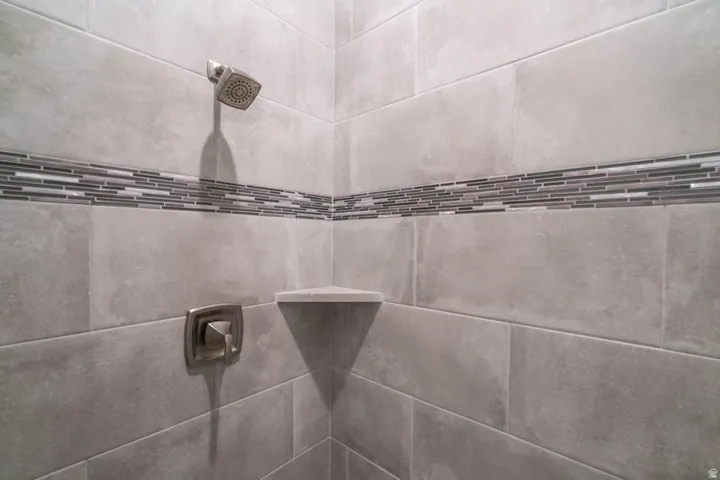 Bathroom view of a tile shower