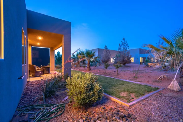 Yard at dusk featuring a patio area and a yard