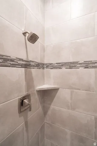 Bathroom view of a tile shower