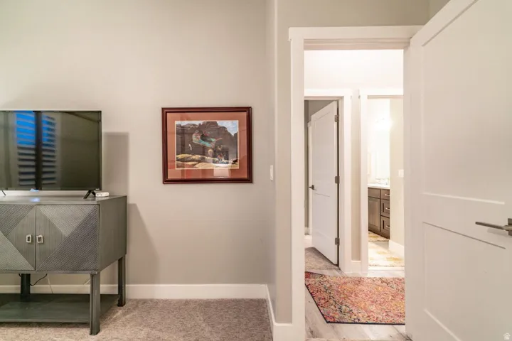Corridor featuring baseboards