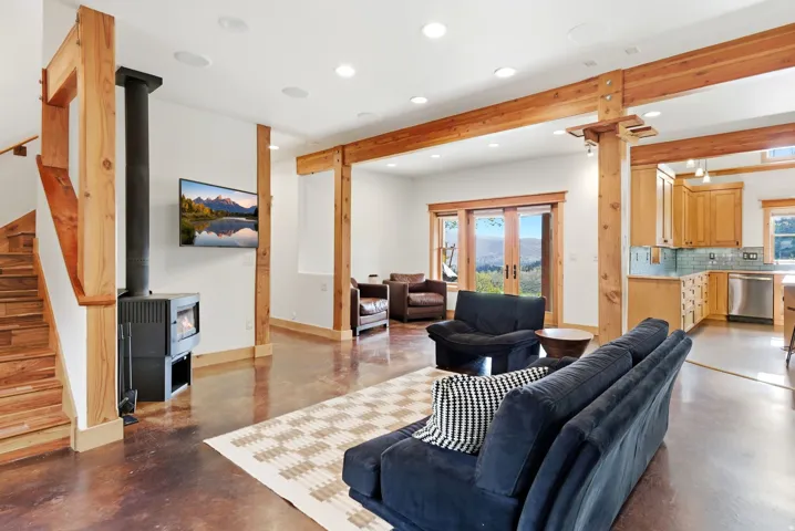 Wood-finish flooring throughout, complemented by exposed timber beams and columns