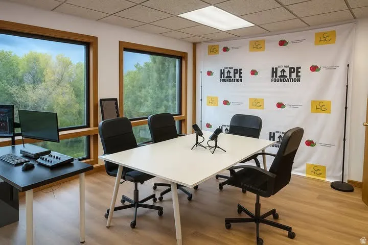 Interior space featuring wood-finish flooring, recessed lighting, and expansive windows with wood trim