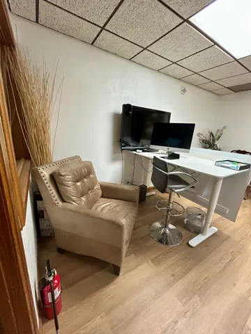 Wood-finish flooring throughout the room