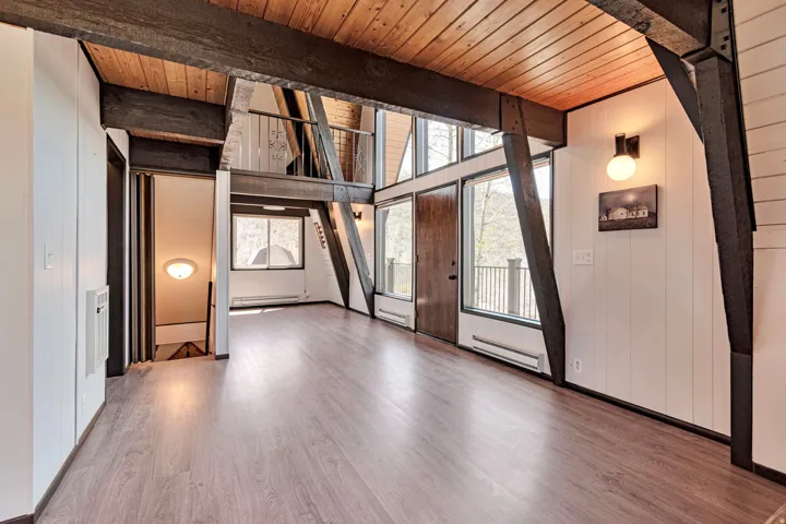 Vaulted ceilings featuring exposed wood beams