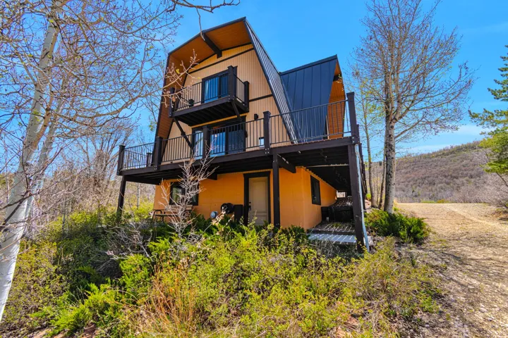 A-frame architectural style featuring a dark metal roof