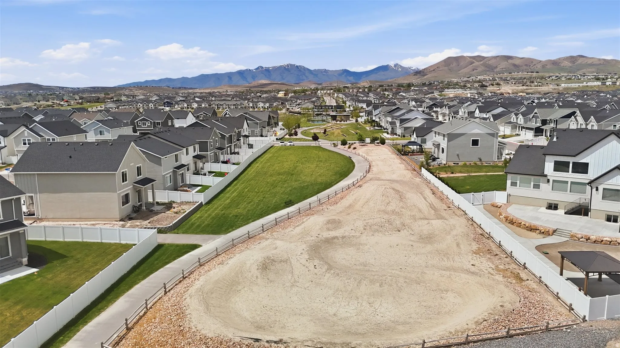 Expansive land parcel with surrounding residential development