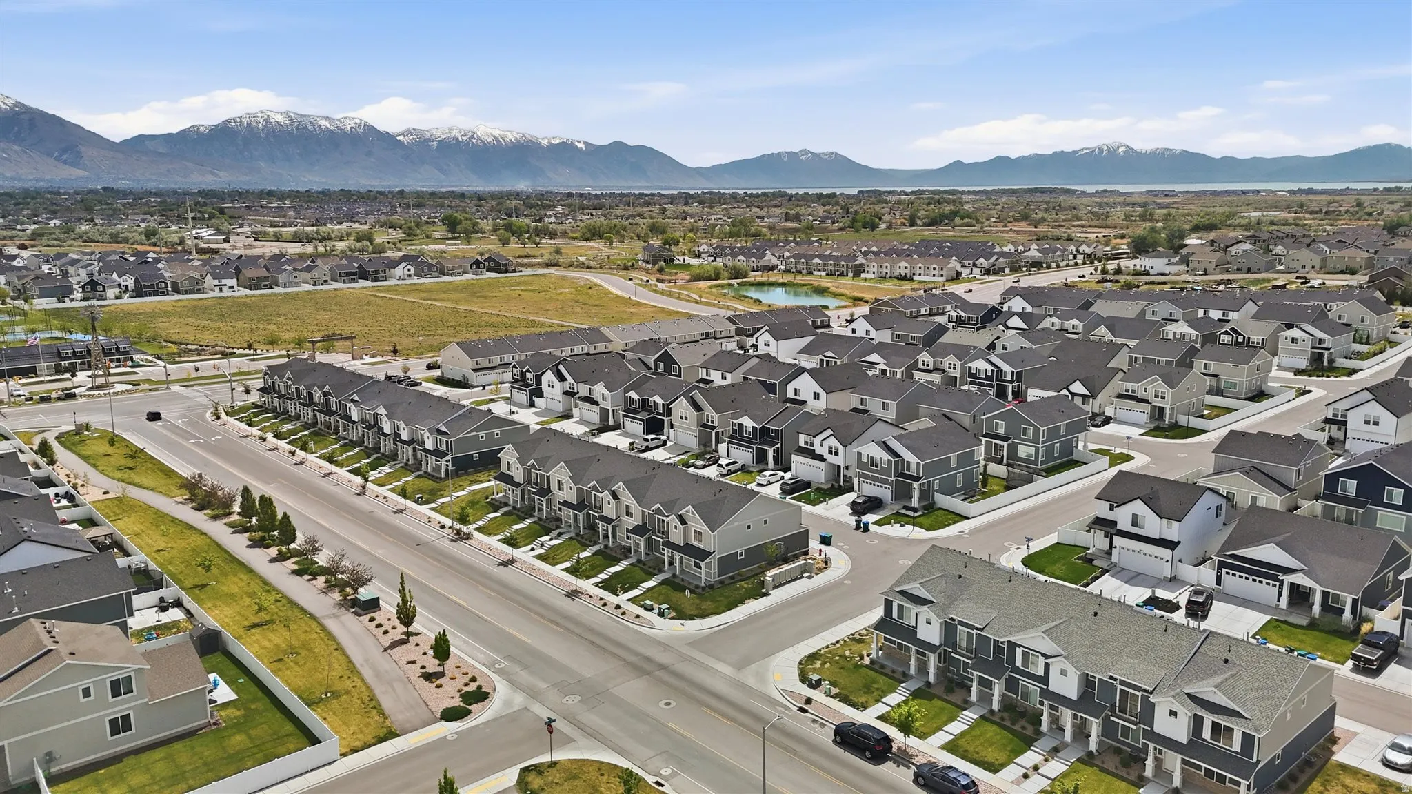 New construction residential development featuring a structured street grid and consistent architectural styles